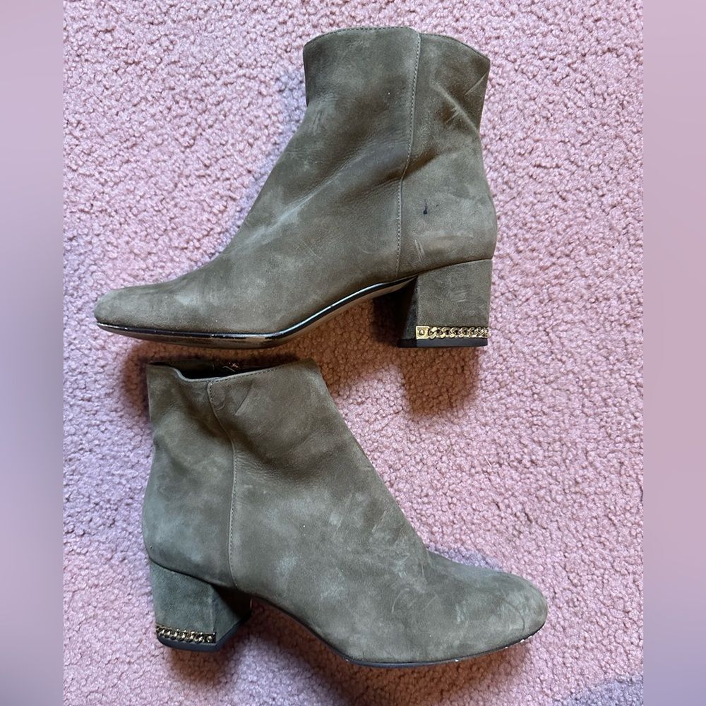 Michael Kors Sabrina leather ankle boot with gold tone heel chain.